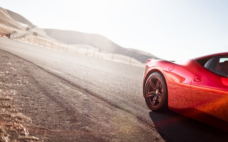 red sports car on desert road