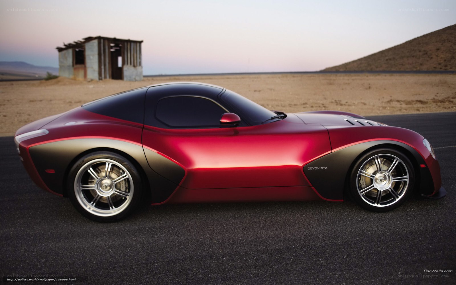 Red sports car on desert road