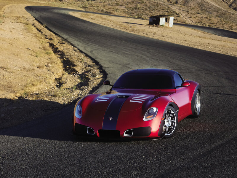 Red sports car on desert road