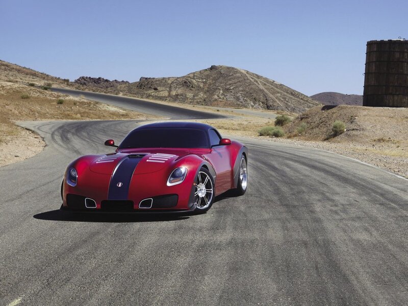 Red sports car on desert road