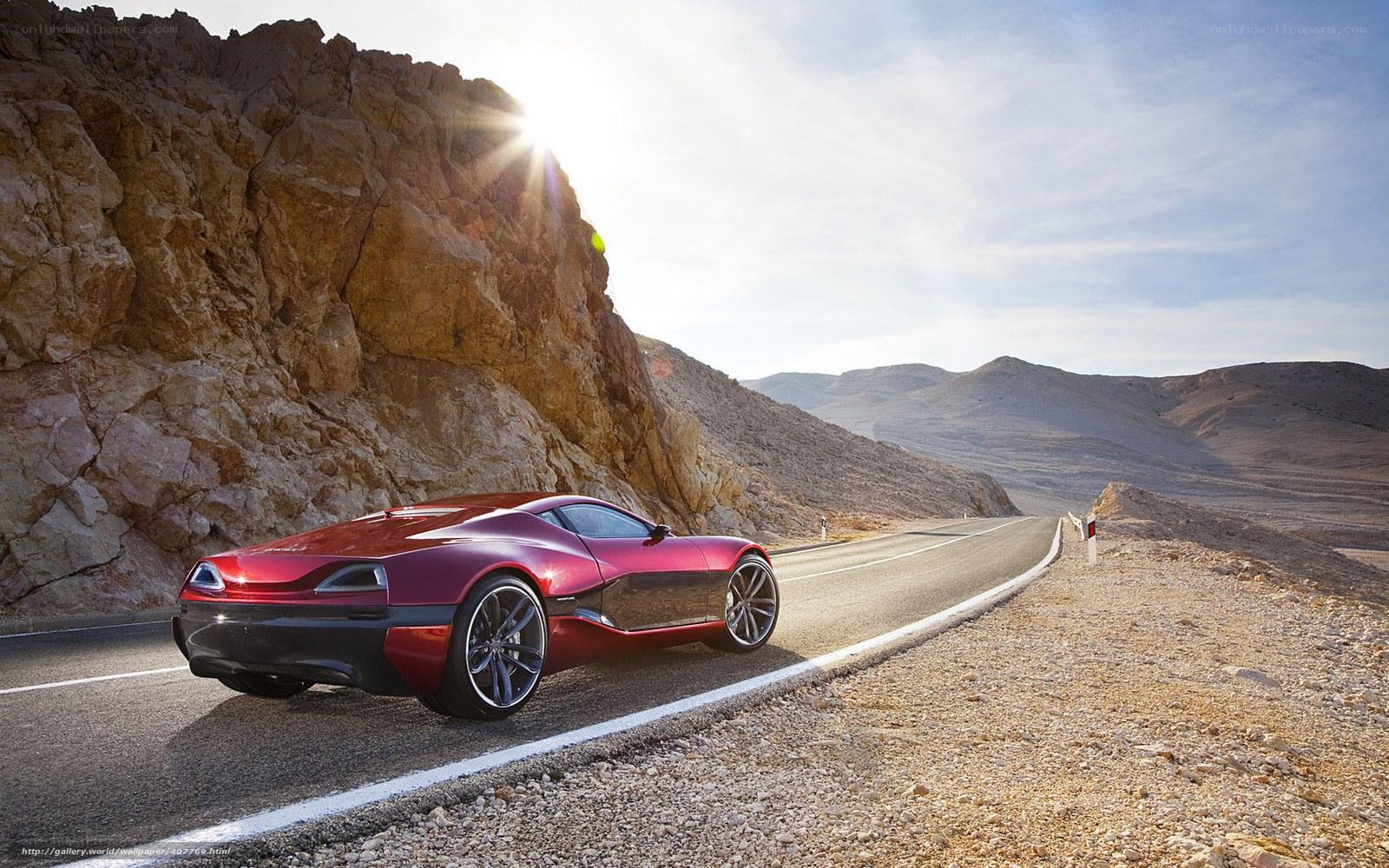 Red sports car on desert road