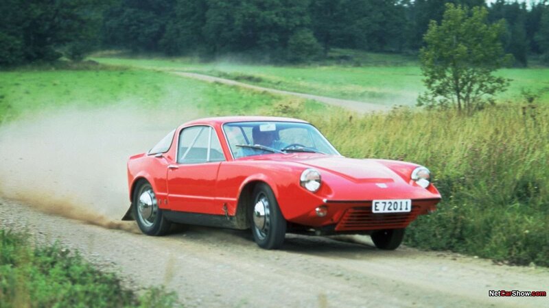 red sports car on dirt road