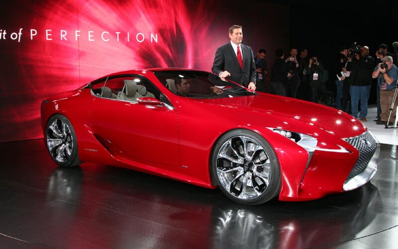 Red Sports Car on Display — Dramatic, Photograph