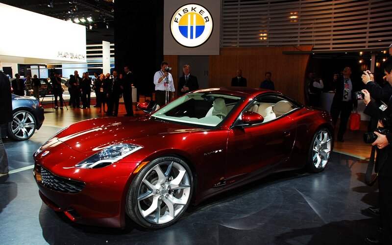 Red Sports Car on Display — Formal, Photograph, People