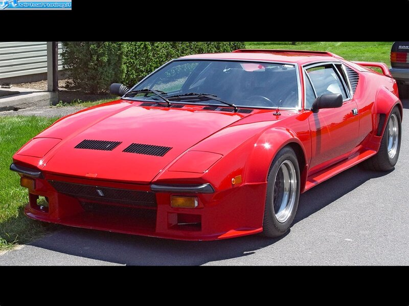 Red sports car on driveway