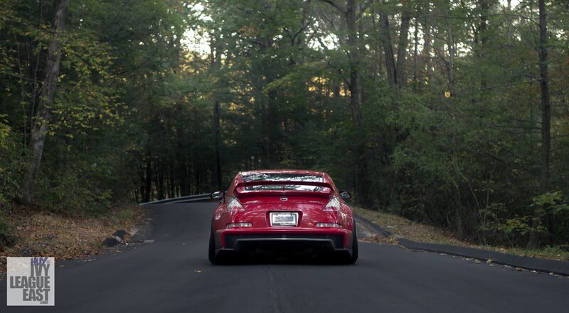 Red sports car on forest road