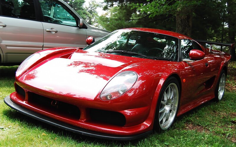 Red sports car on grass