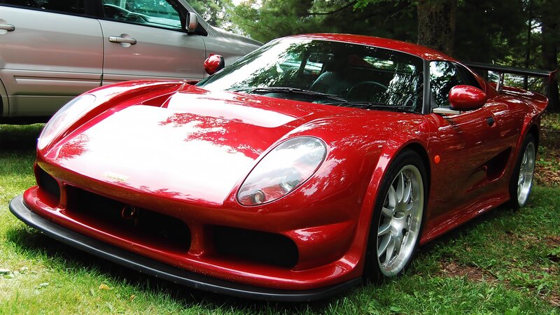 Red sports car on grass