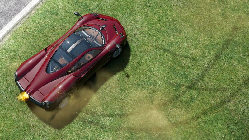 Red sports car on grass