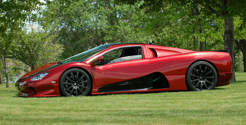 Red sports car on grass