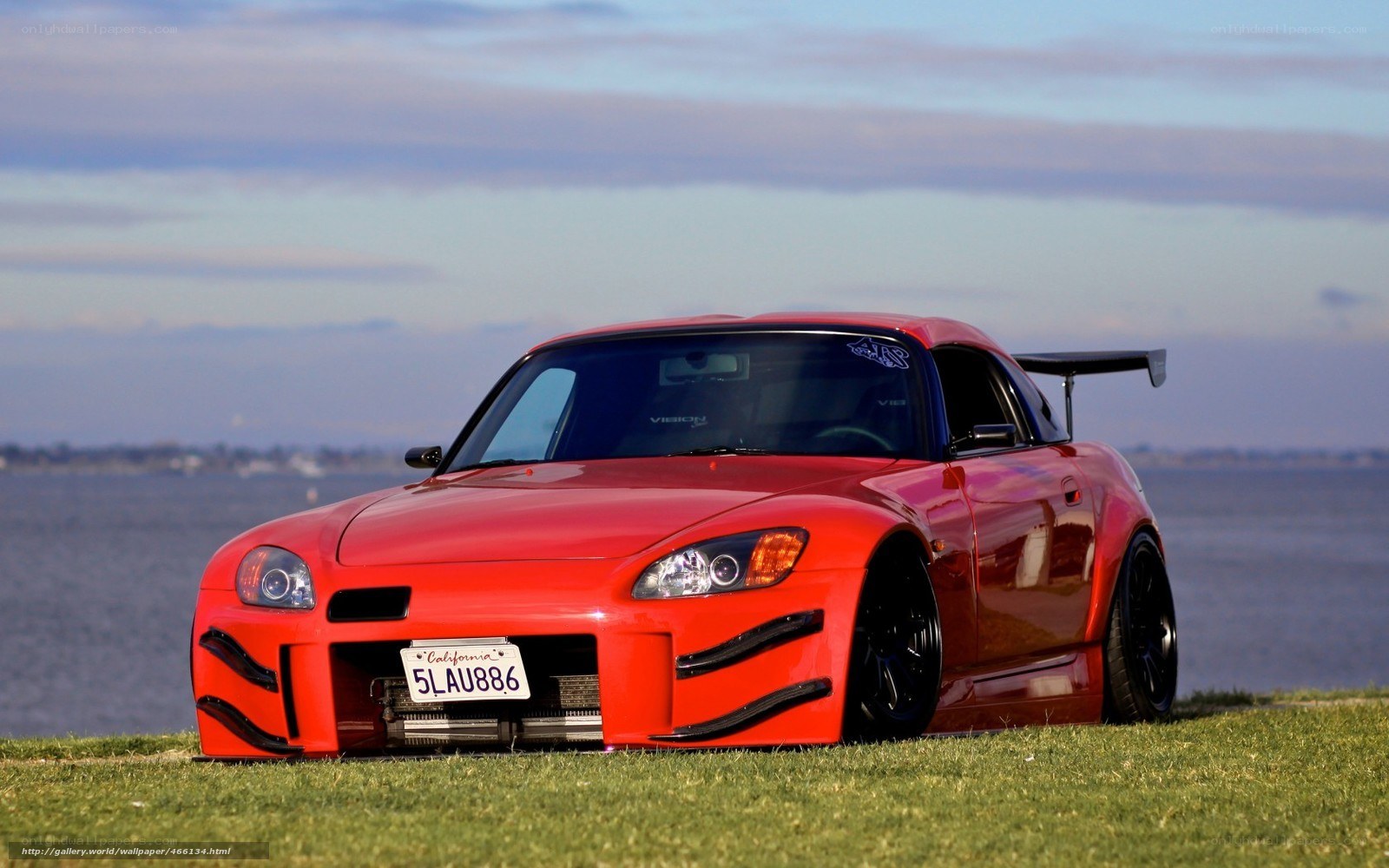 Red sports car on grass
