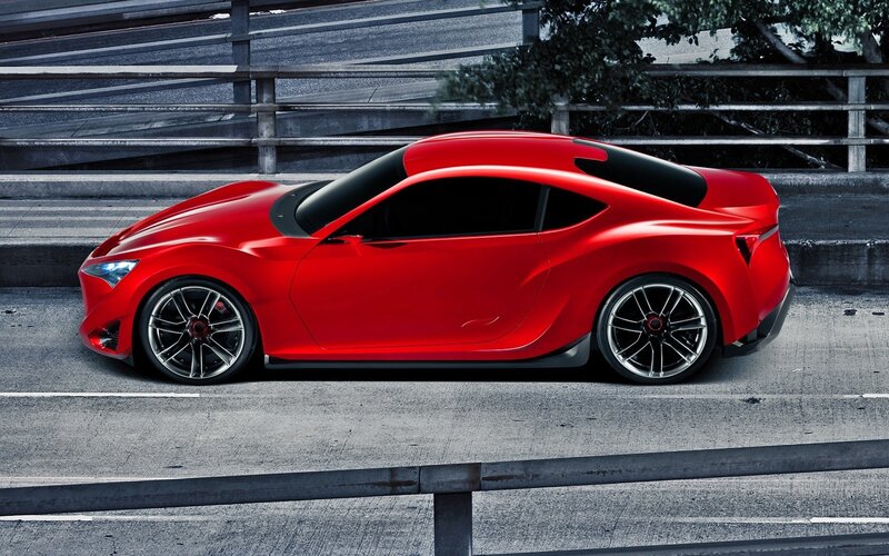 Red sports car on highway