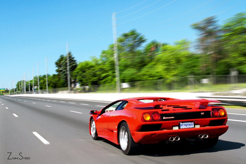 red sports car on highway