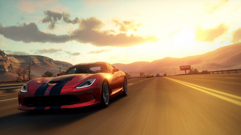 Red sports car on highway at sunset