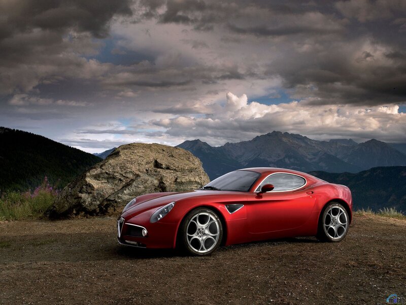 Red sports car on mountain overlook