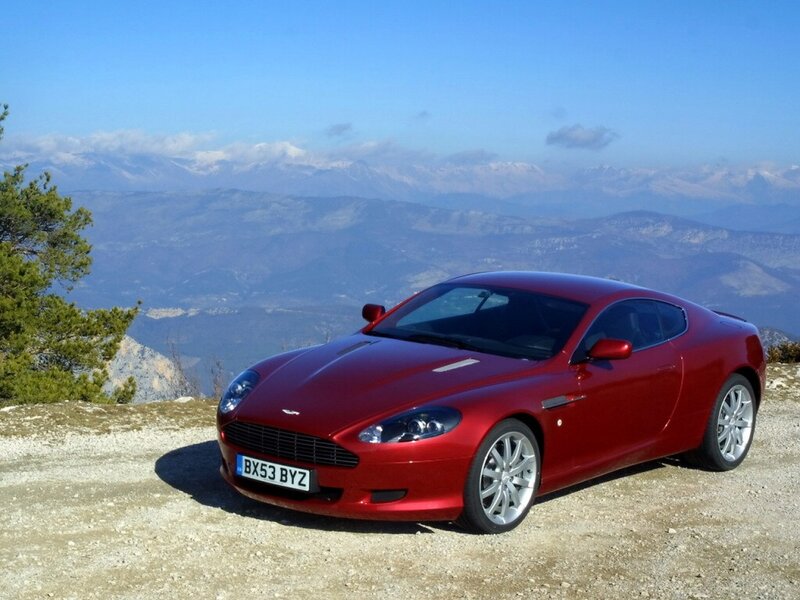 Red sports car on mountain overlook