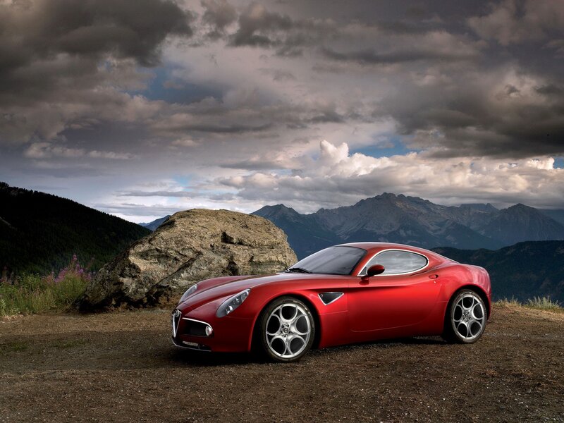 Red sports car on mountain overlook