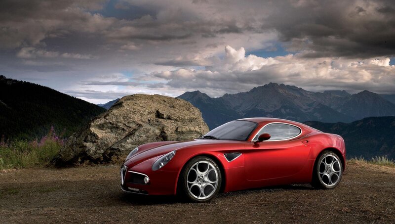Red sports car on mountain overlook