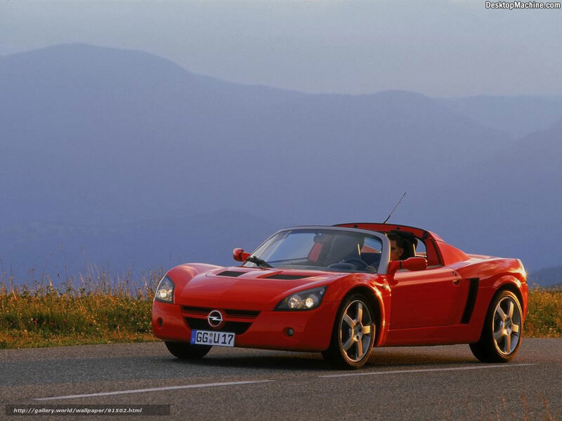 Red sports car on mountain road
