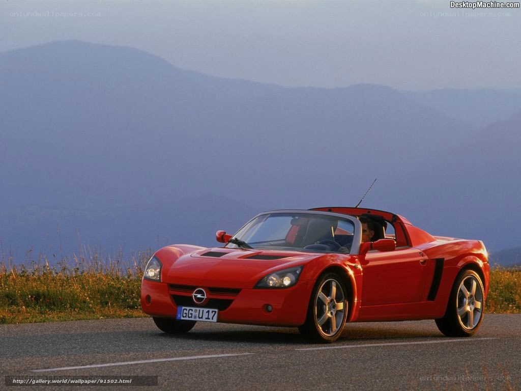 Red sports car on mountain road