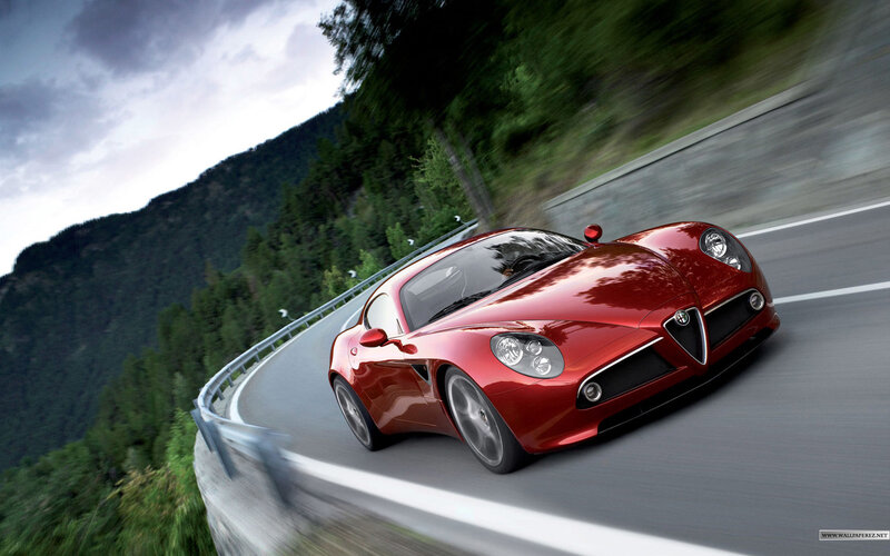 red sports car on mountain road