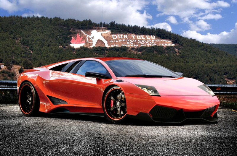 Red sports car on mountain road