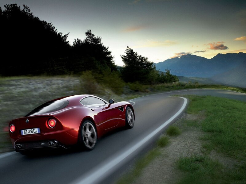 Red sports car on mountain road