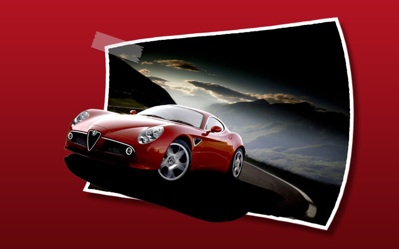 Red sports car on mountain road