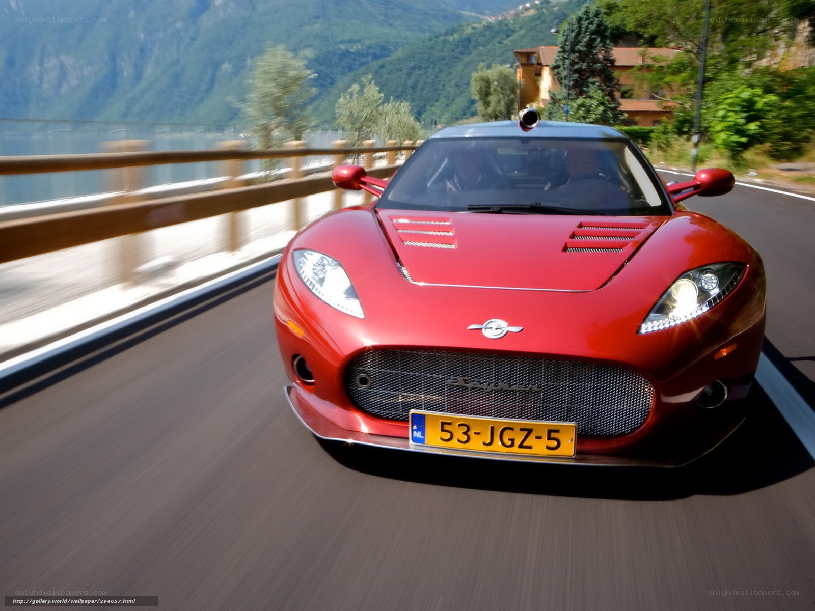 red sports car on mountain road