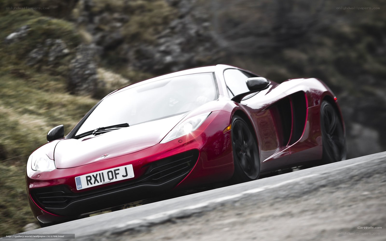 red sports car on mountain road