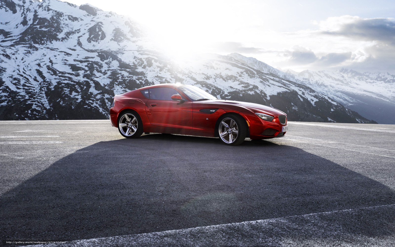 Red sports car on mountain road