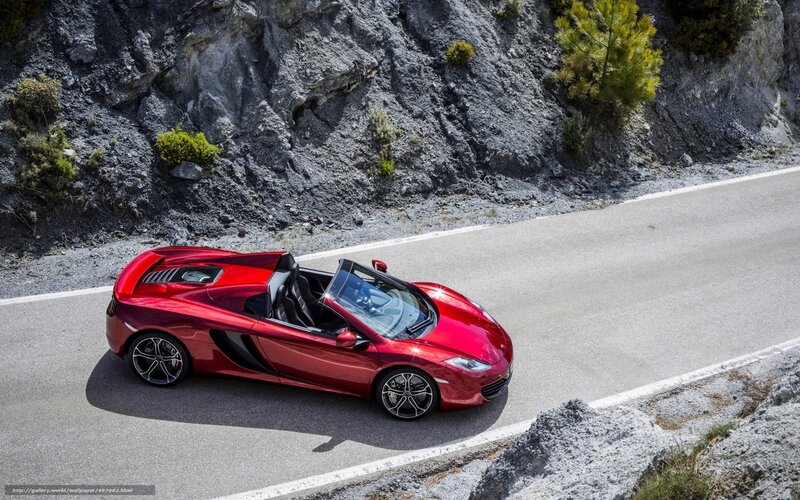 Red sports car on mountain road