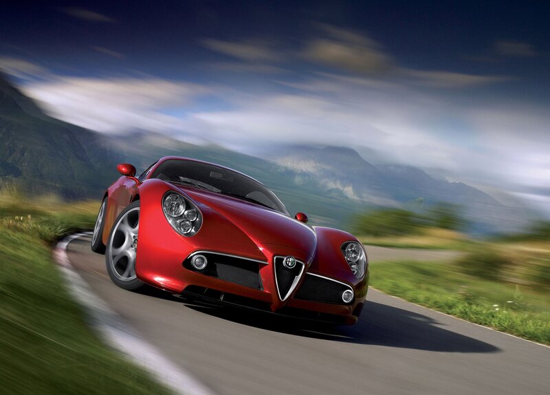Red sports car on mountain road