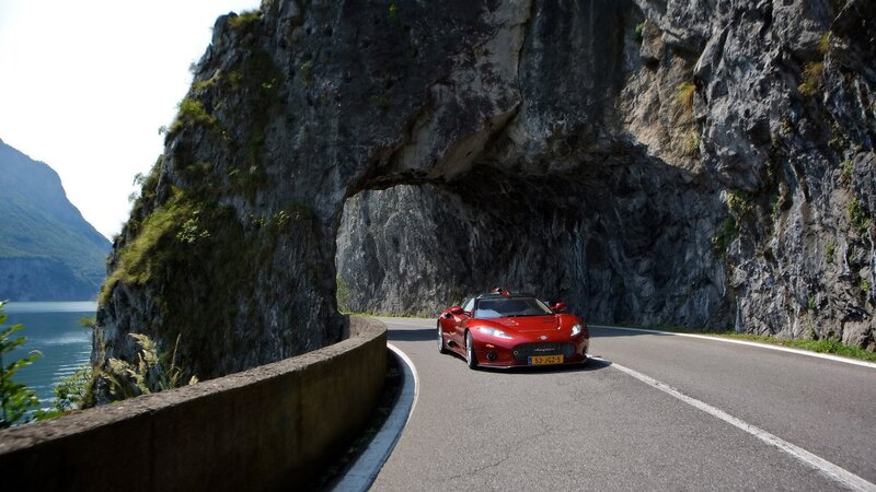 Red sports car on mountain road