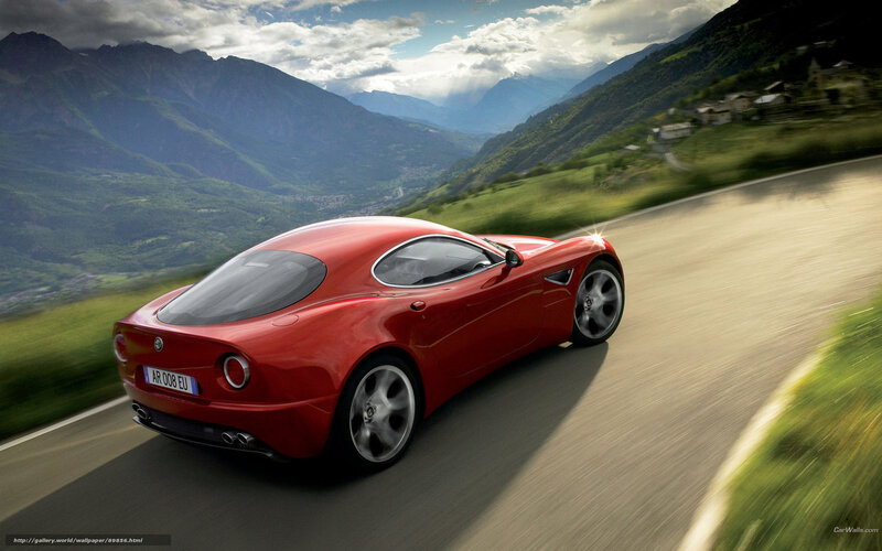 Red sports car on mountain road
