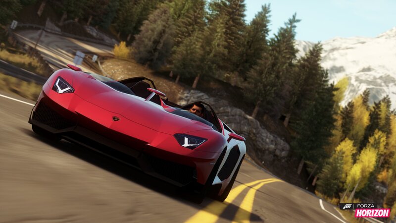 red sports car on mountain road