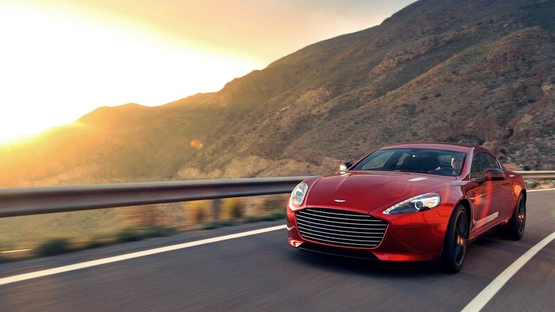 Red sports car on mountain road