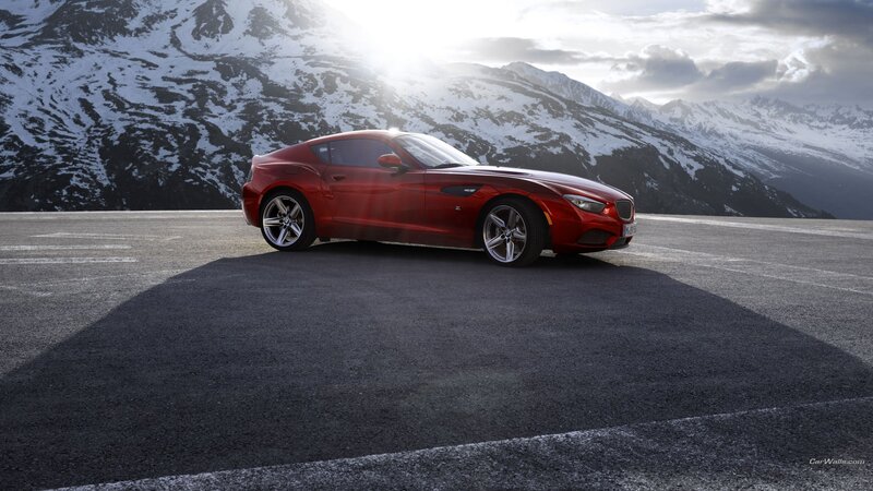 Red sports car on mountain road