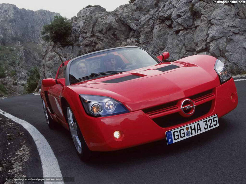 Red sports car on mountain road