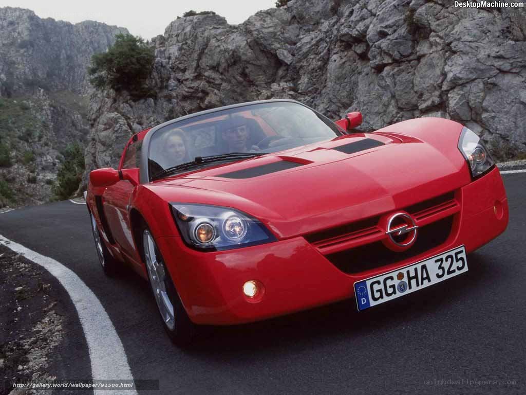 Red sports car on mountain road