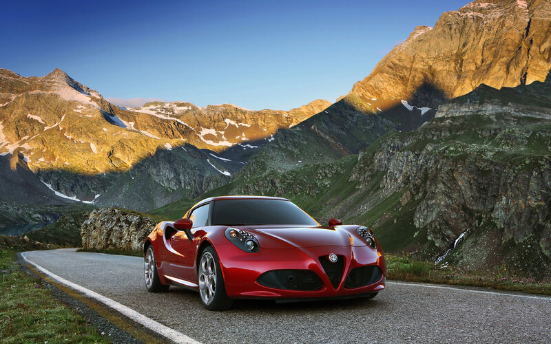 Red Sports Car on Mountain Road — Dramatic, Sunset