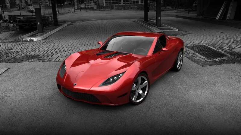 Red sports car on paved lot