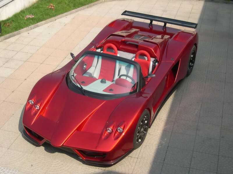 Red sports car on pavement