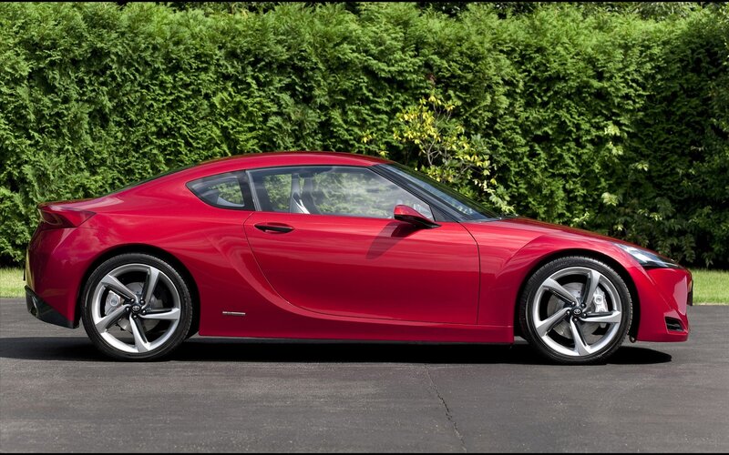 Red sports car on pavement