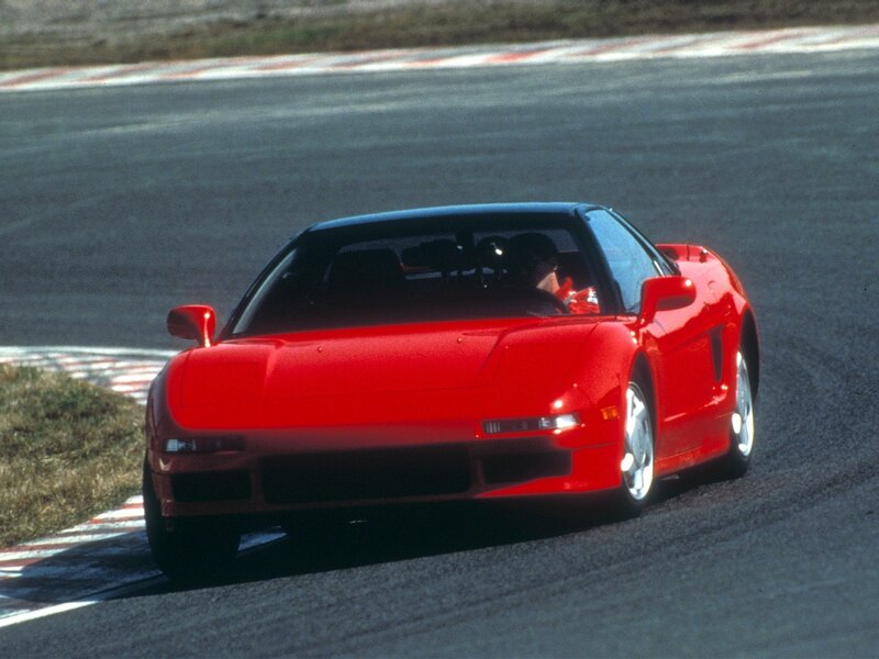 Red sports car on racetrack
