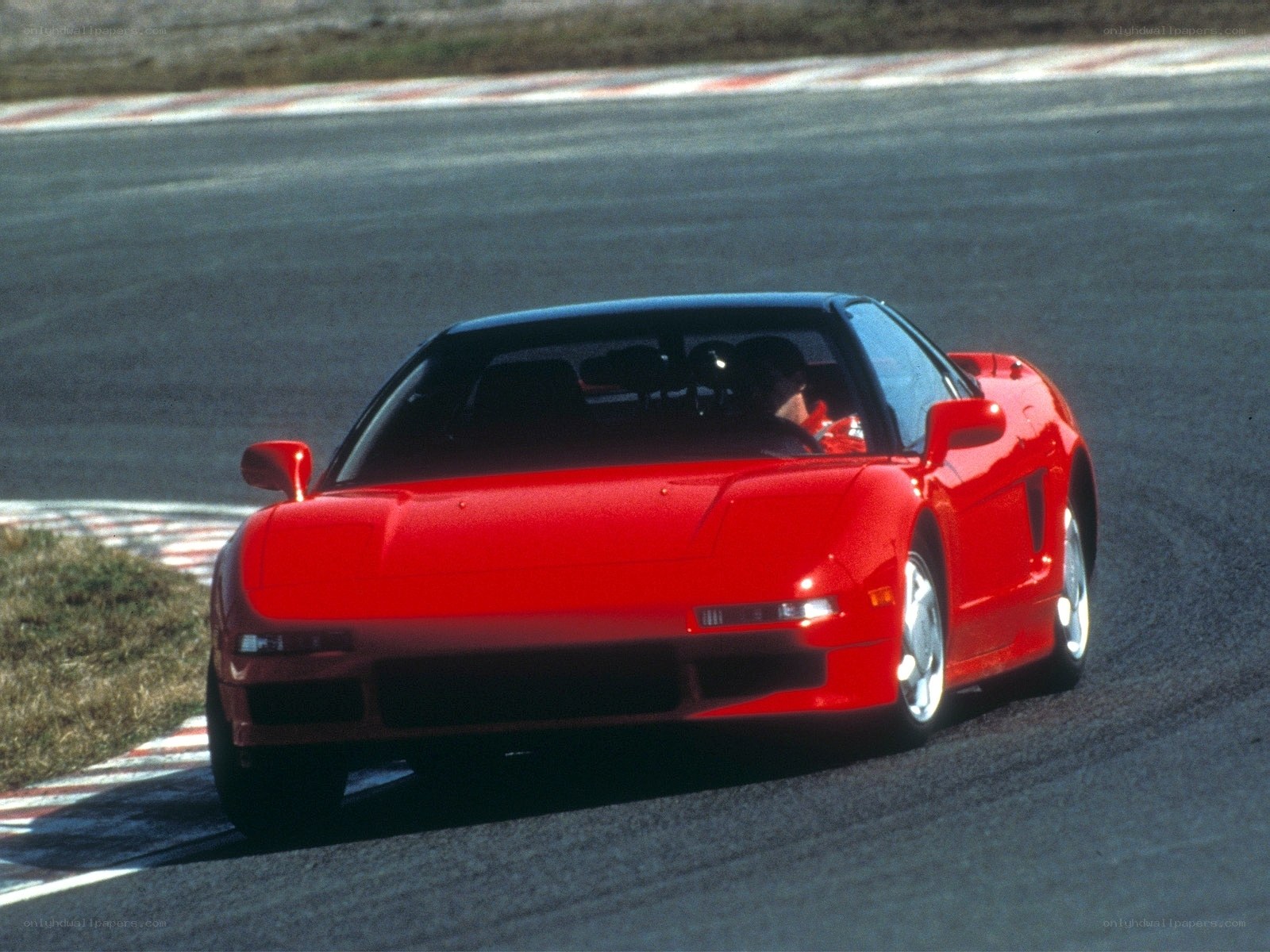 Red sports car on racetrack