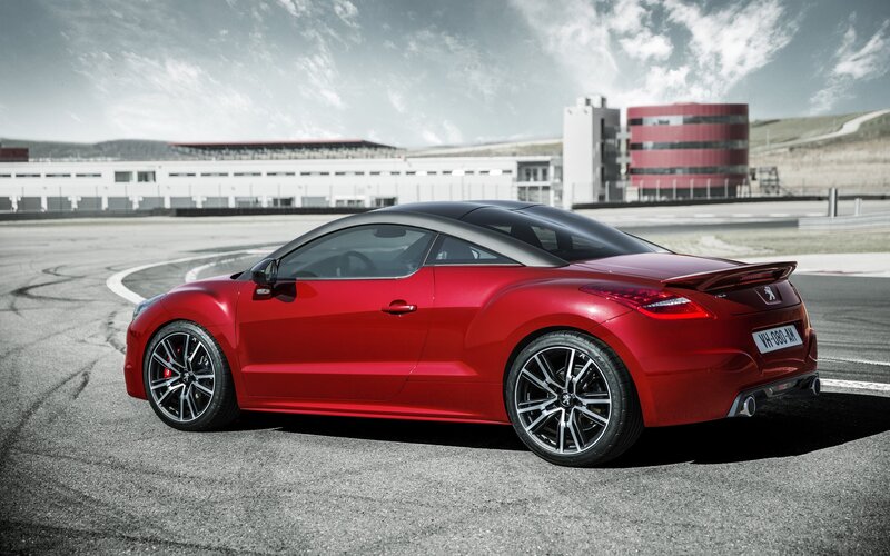 Red sports car on racetrack