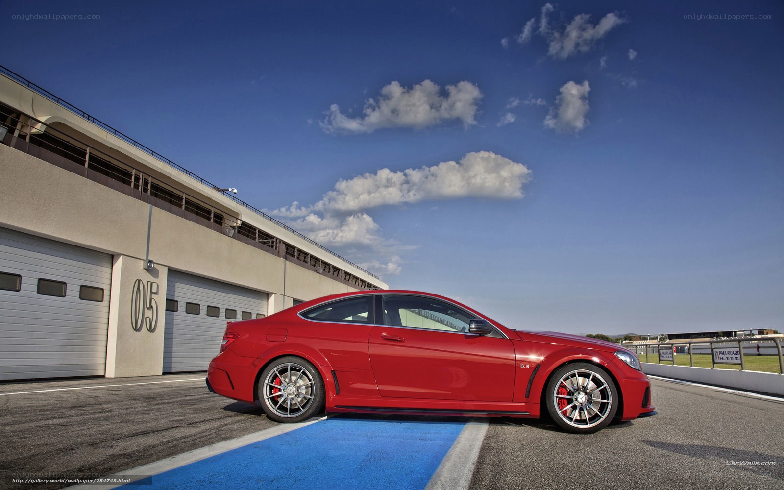 Red sports car on racetrack