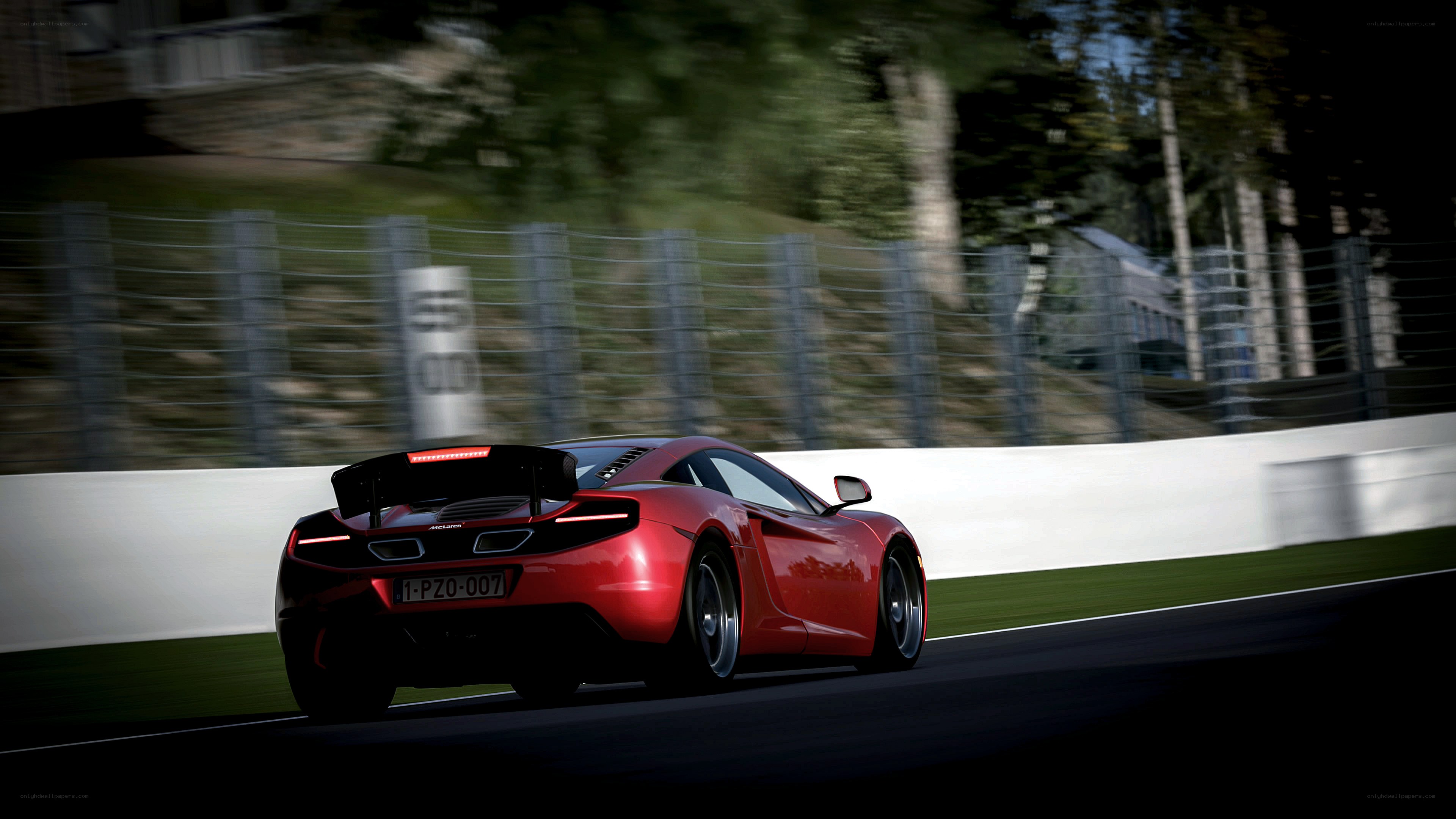 red sports car on racetrack