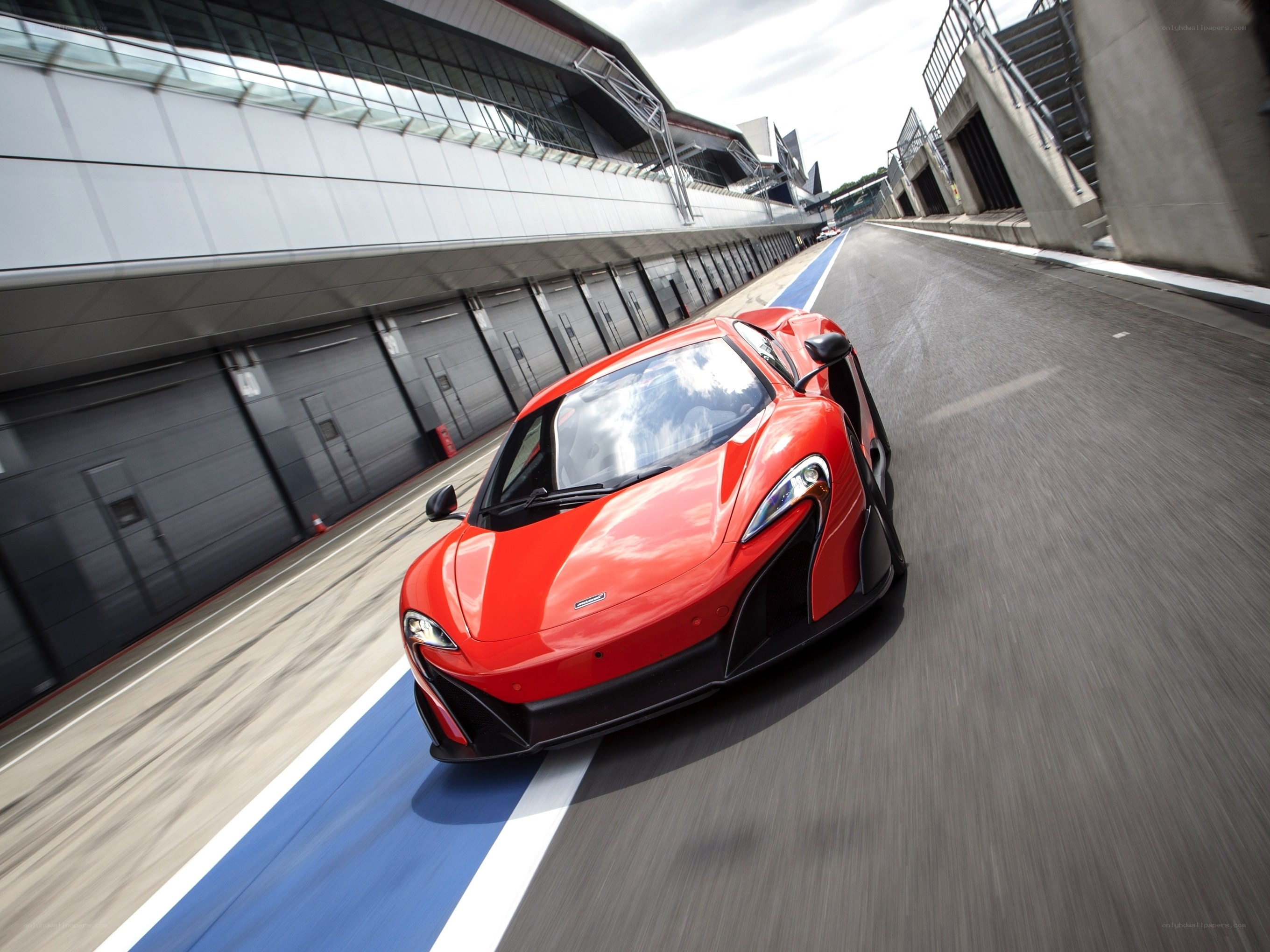 Red sports car on racetrack